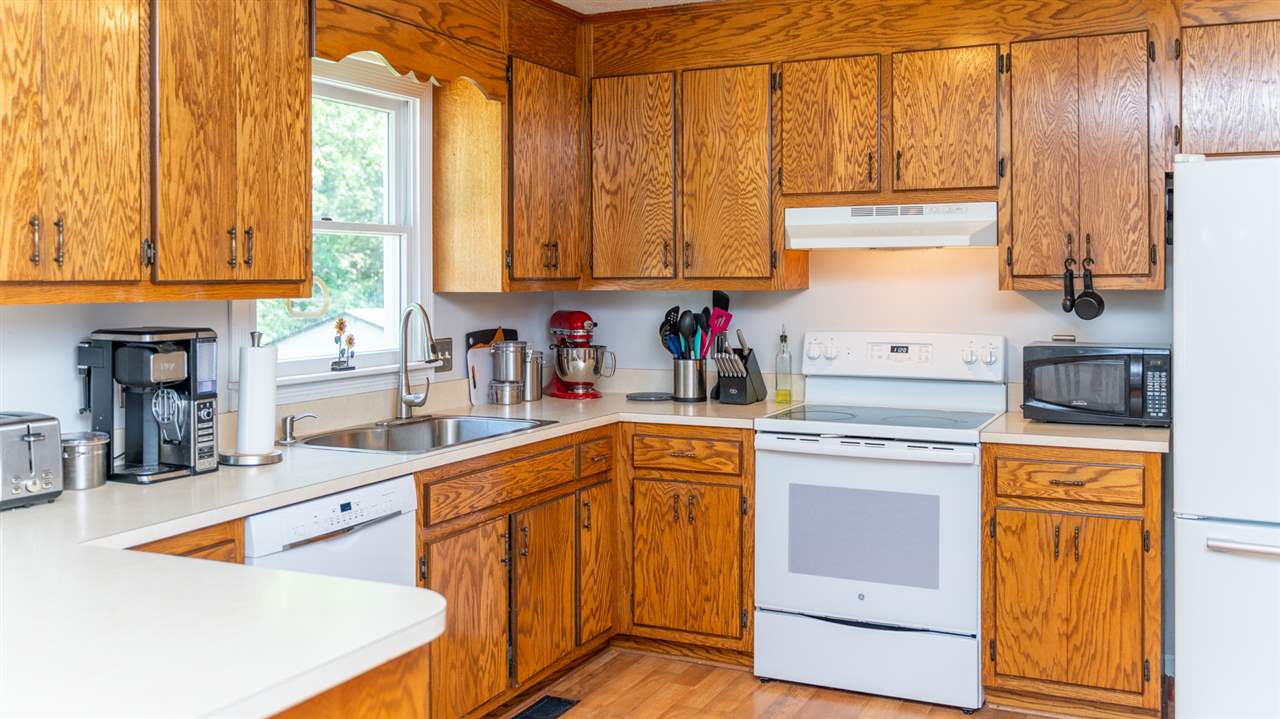 104 Buckboard Road Waynesboro, VA 22980 - Photo 11 of 43 a kitchen with stainless steel appliances granite countertop a sink a stove and cabinets