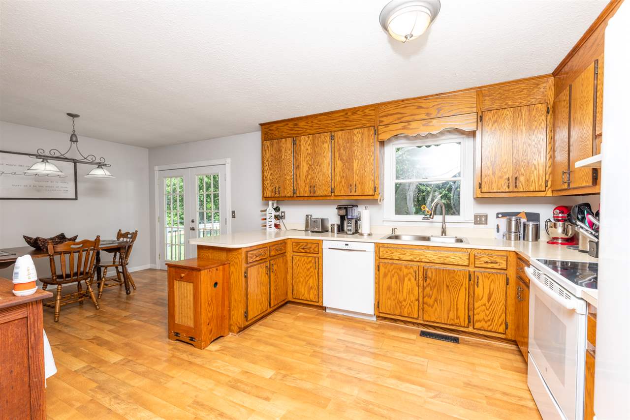 104 Buckboard Road Waynesboro, VA 22980 - Photo 15 of 43 a large kitchen with stainless steel appliances granite countertop a sink and cabinets