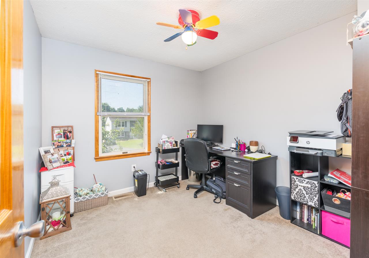 104 Buckboard Road Waynesboro, VA 22980 - Photo 25 of 43 a view of a workspace with furniture and a window