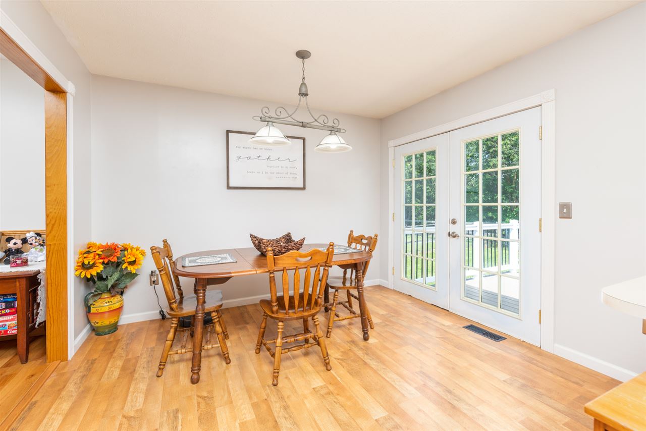 104 Buckboard Road Waynesboro, VA 22980 - Photo 6 of 43 a dining room with furniture a chandelier and wooden floor