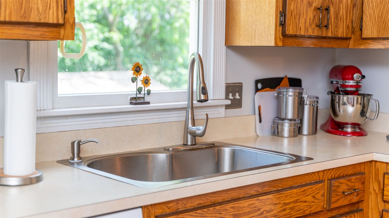 104 Buckboard Road Waynesboro, VA 22980 - Photo 10 of 43 a kitchen sink with granite countertop a sink and cabinets