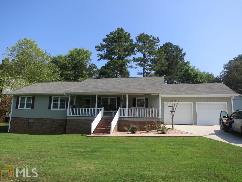 36 Surrey Trail Southeast Rome, GA 30161 - Photo 1 of 1 a view of a house with a yard and a car park fire pit