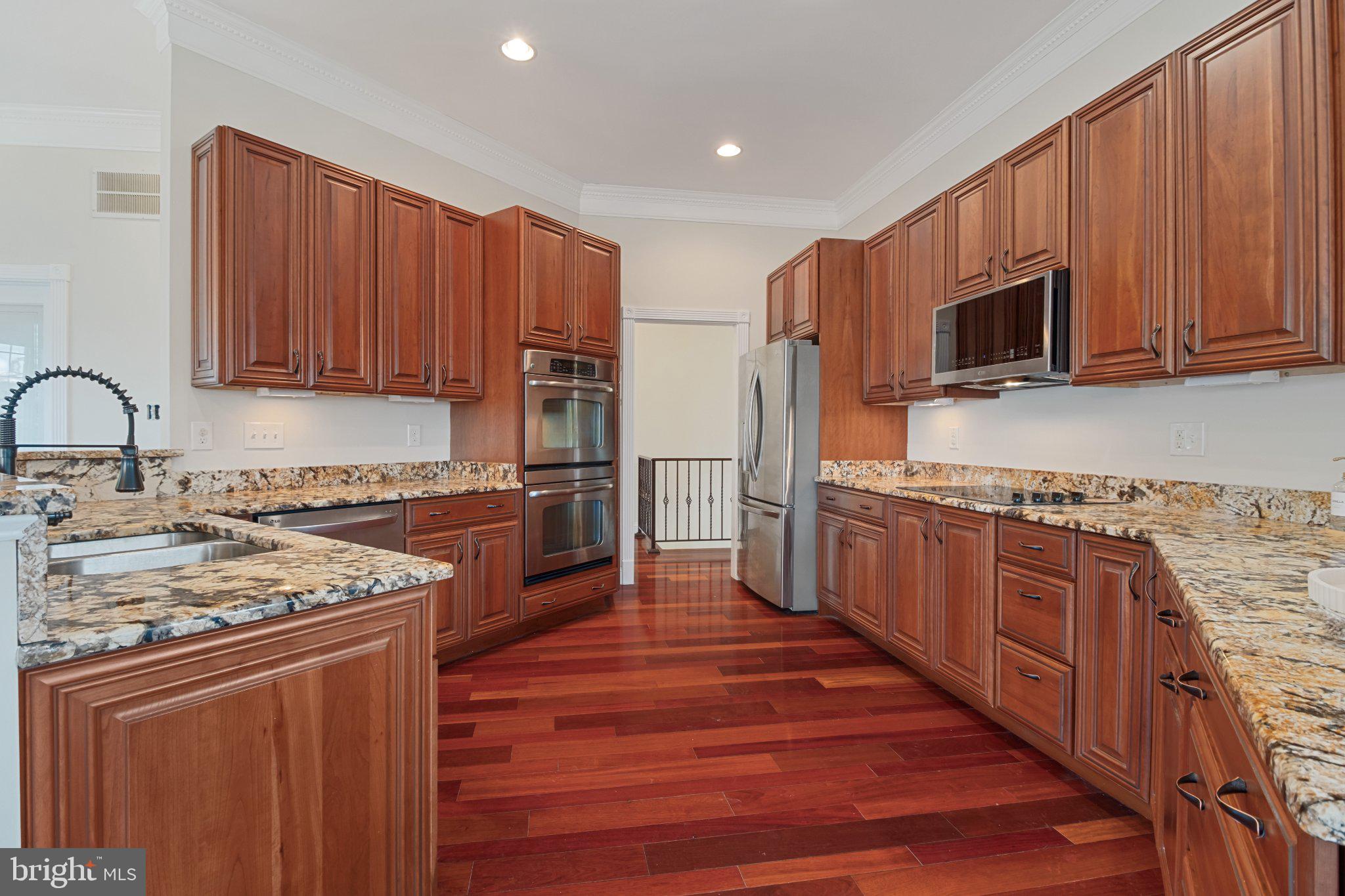 7147 Linganore Road New Market, MD 21774 - Photo 11 of 44 Elegant kitchen with rich wood tones.
