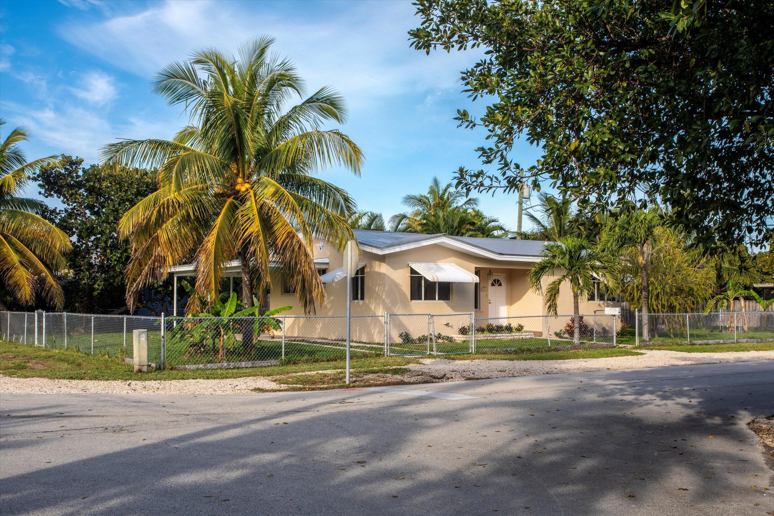 1228 11th Street Key West, FL 33040 - Photo 1 of 17 a view of road and trees
