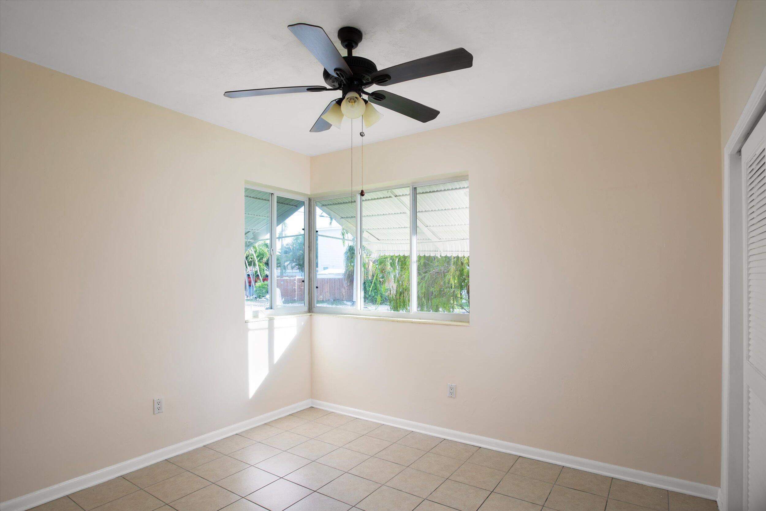 1228 11th Street Key West, FL 33040 - Photo 11 of 17 a view of empty room with ceiling fan