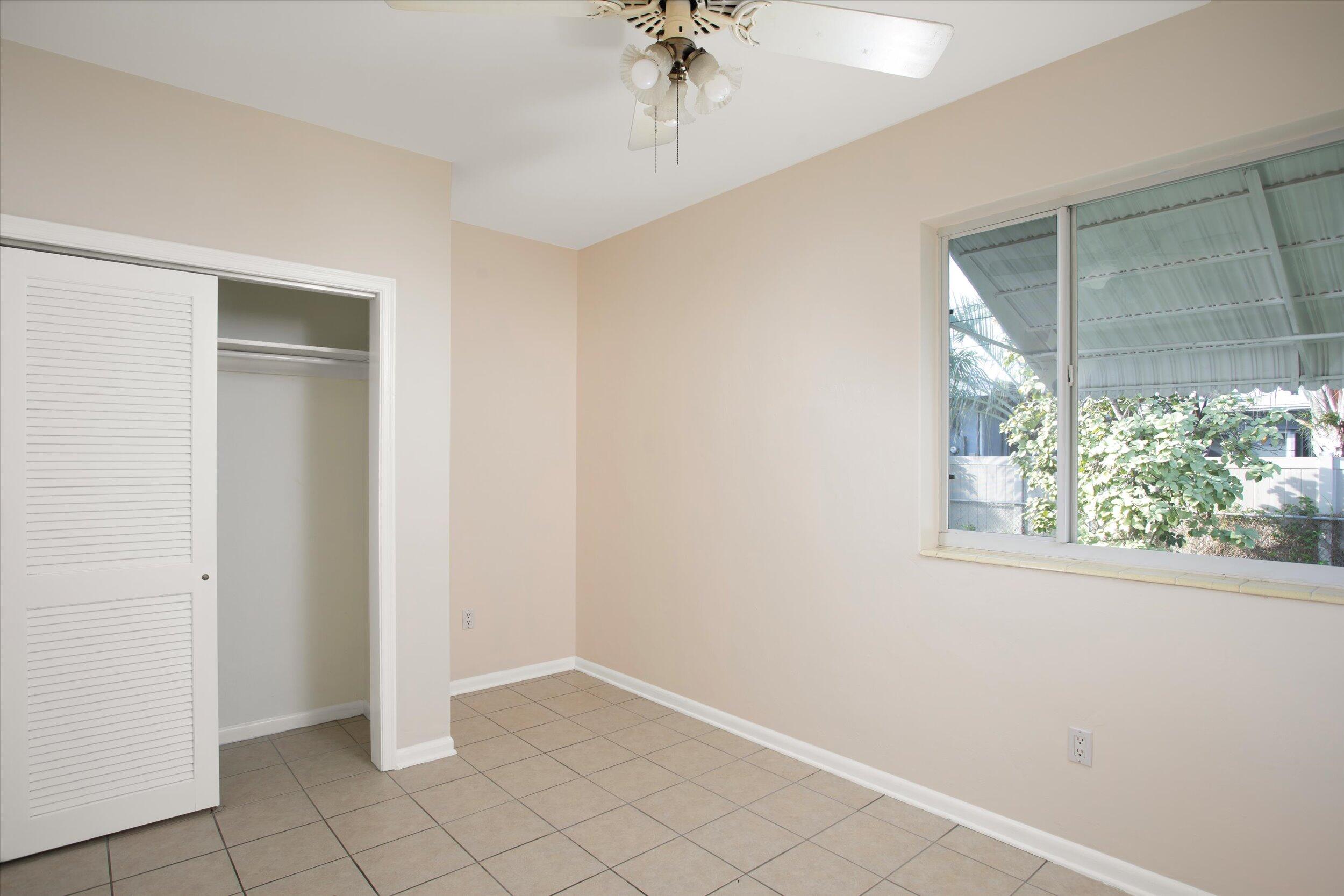 1228 11th Street Key West, FL 33040 - Photo 12 of 17 an empty room with windows and closet