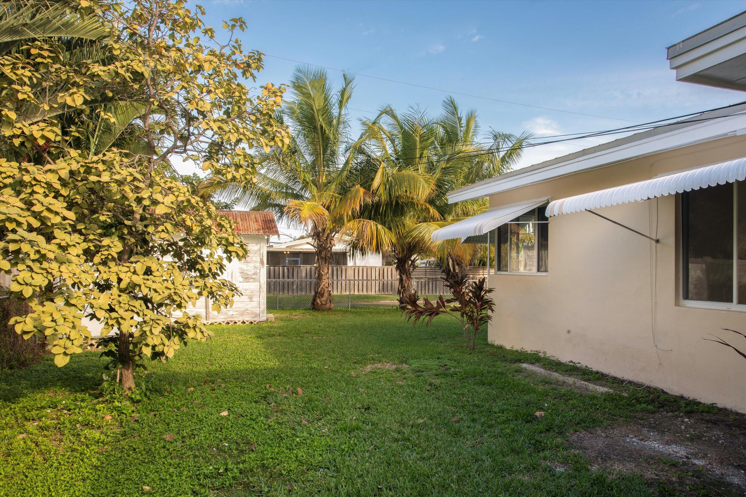 1228 11th Street Key West, FL 33040 - Photo 14 of 17 a view of a yard in front of house