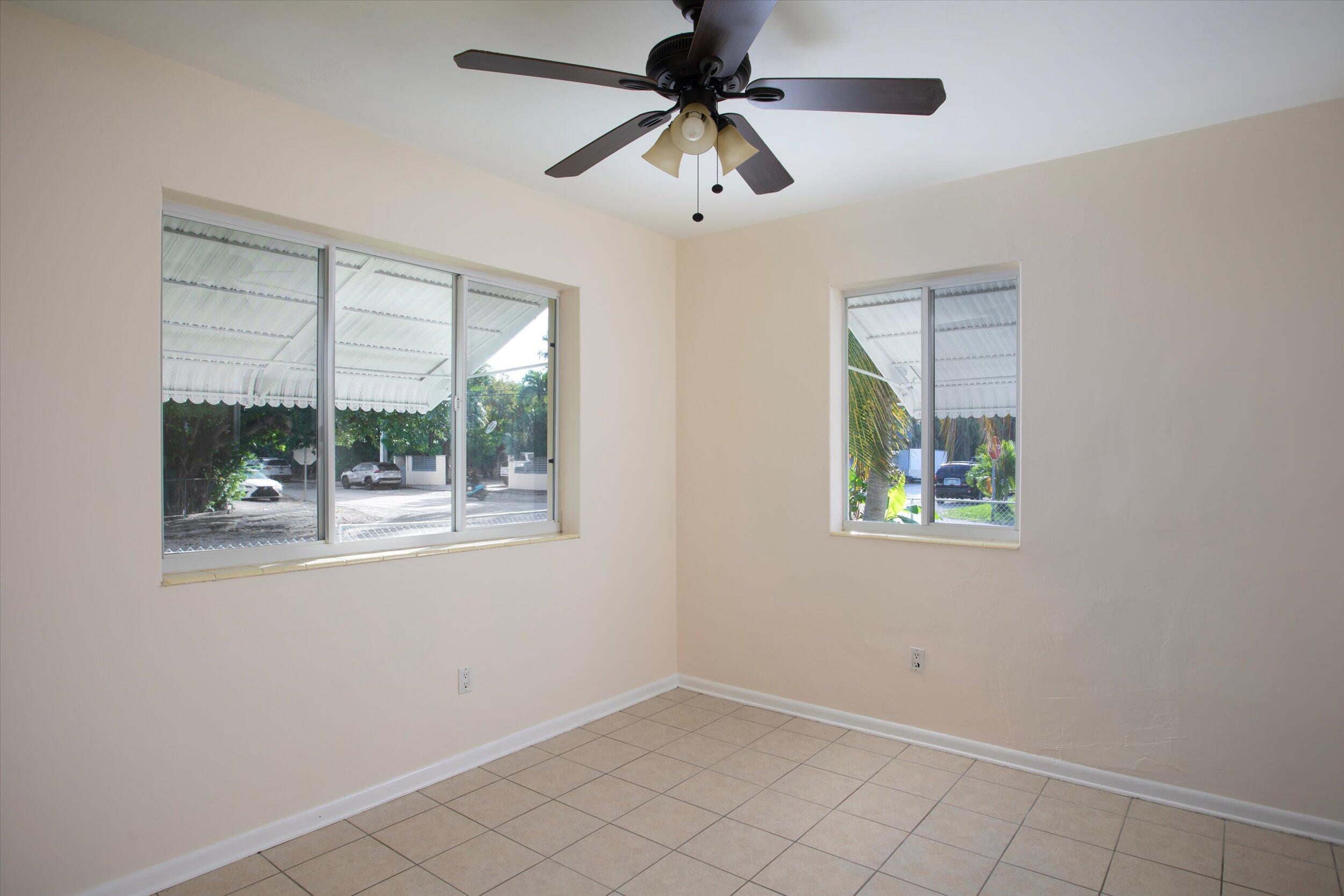 1228 11th Street Key West, FL 33040 - Photo 9 of 17 a view of an empty room with a window