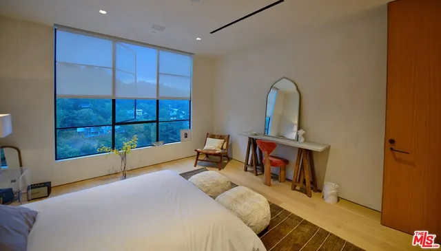 a bathroom with a tub a sink and mirrors