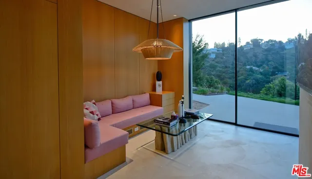 a bedroom with furniture and a flat screen tv