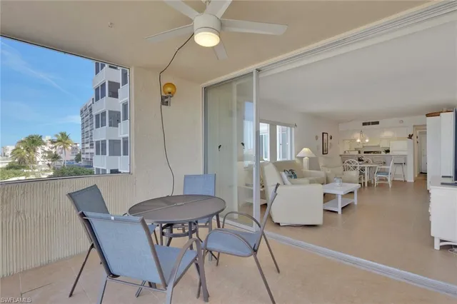a view of a livingroom with furniture and a table
