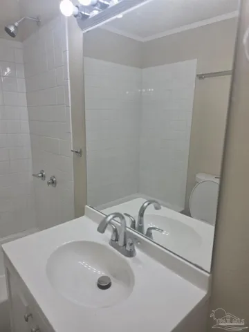 a bathroom with a sink and shower