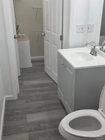 a bathroom with a sink toilet and vanity