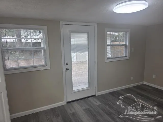 a room with window and a wooden floor