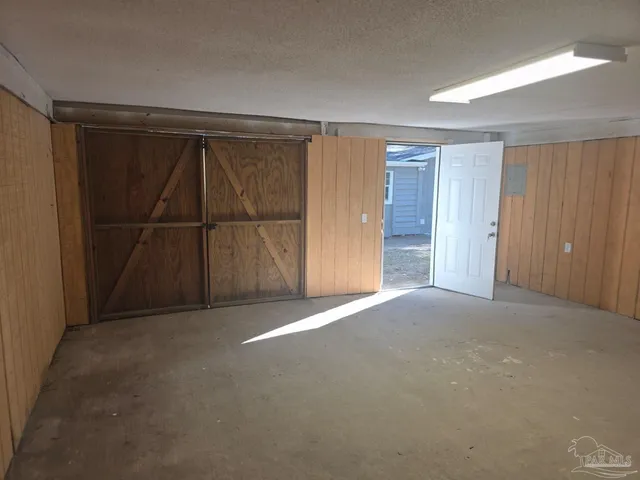 an empty room with wooden door