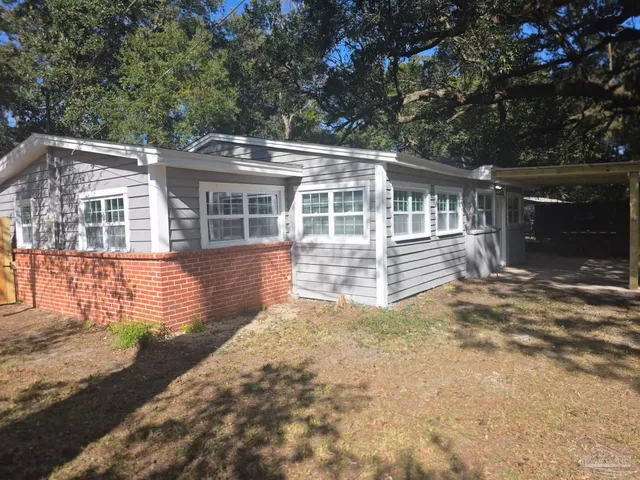 front view of a house with a yard