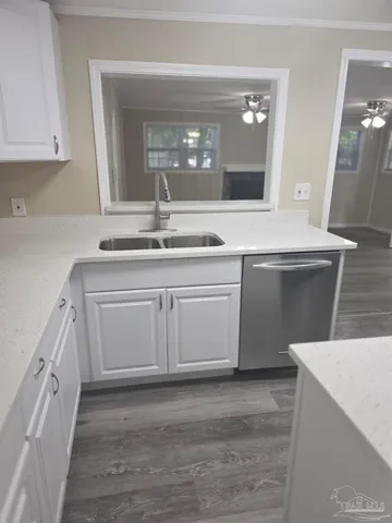 a kitchen with a sink and cabinets