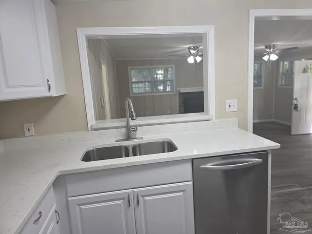 a kitchen with a sink and cabinets