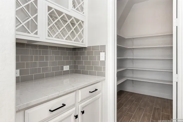 a view of storage and utility room with washer and dryer