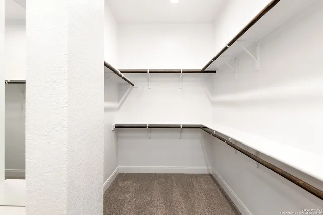 a view of cabinets and wooden floor