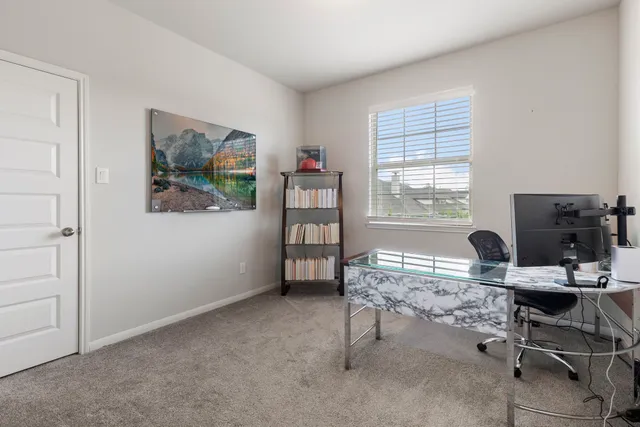 a bedroom with a bed and a potted plant