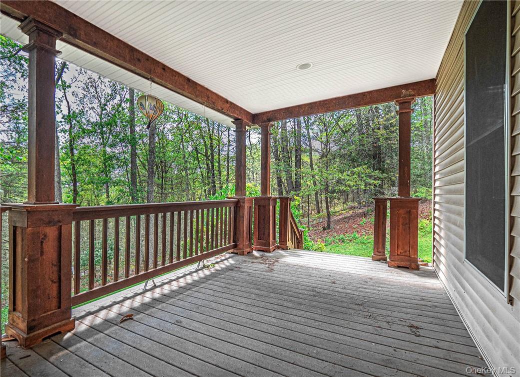 20 Rustic Hills Road Wurtsboro, NY 12790 - Photo 4 of 25 Front porch surrounded by trees...Looking for a woodsy environment off the beaten path, here's your home!!