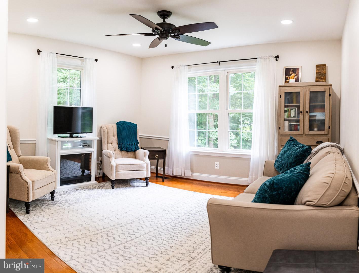 625 Carson Road Huntingtown, MD 20639 - Photo 13 of 21 a living room with furniture and a flat screen tv