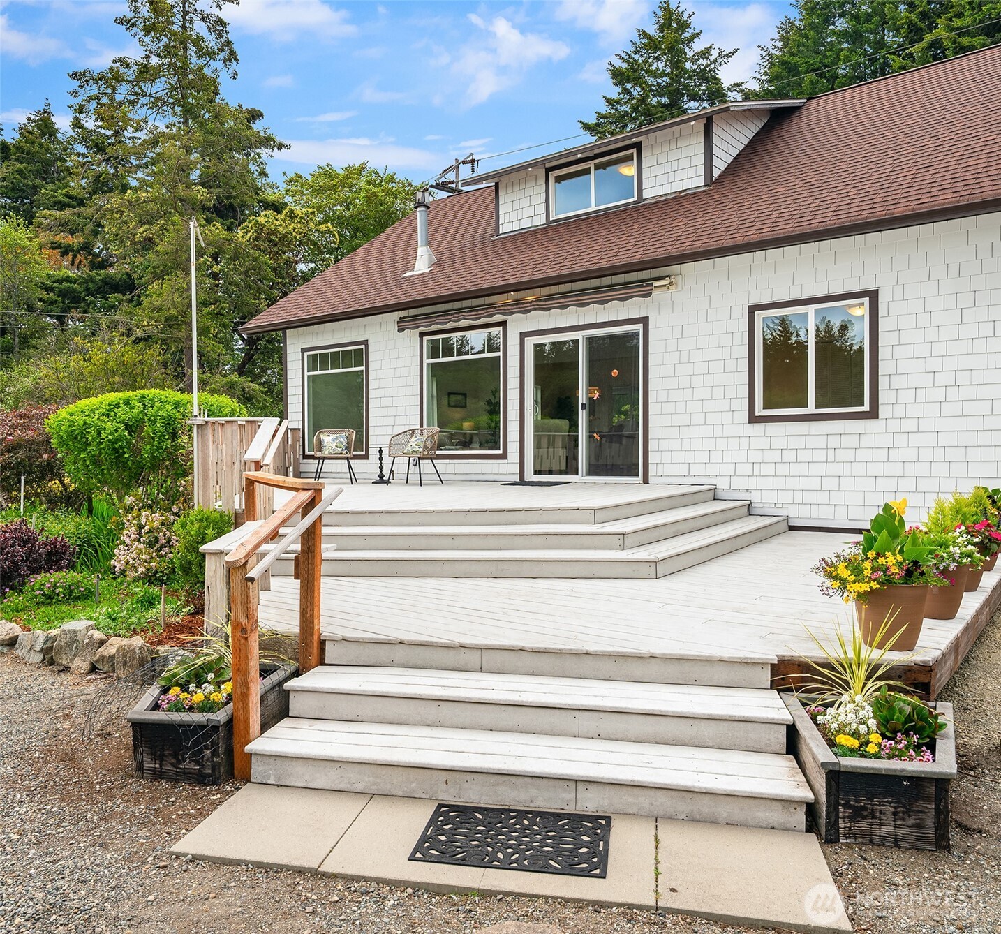 22113 Dockton Road Southwest Vashon, WA 98070 - Photo 14 of 40 a view of a house with sitting area and garden