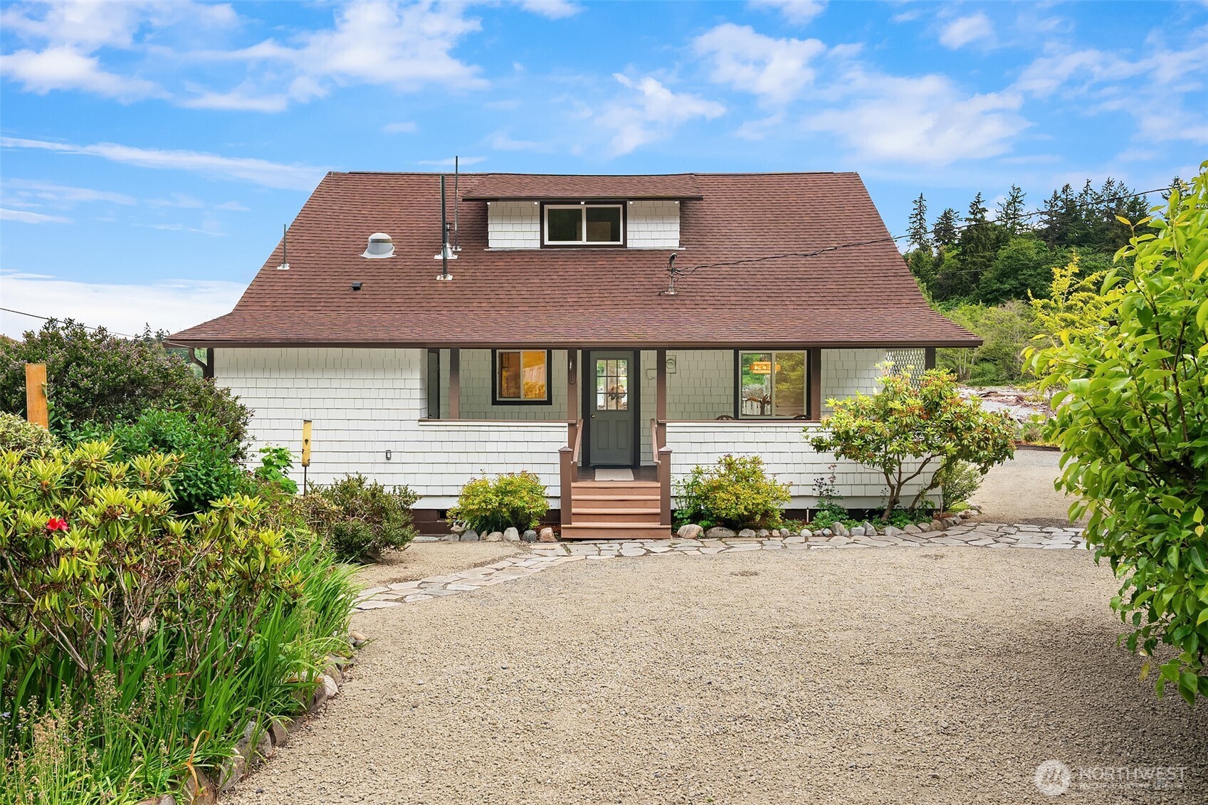 22113 Dockton Road Southwest Vashon, WA 98070 - Photo 15 of 40 a front view of a house with a yard