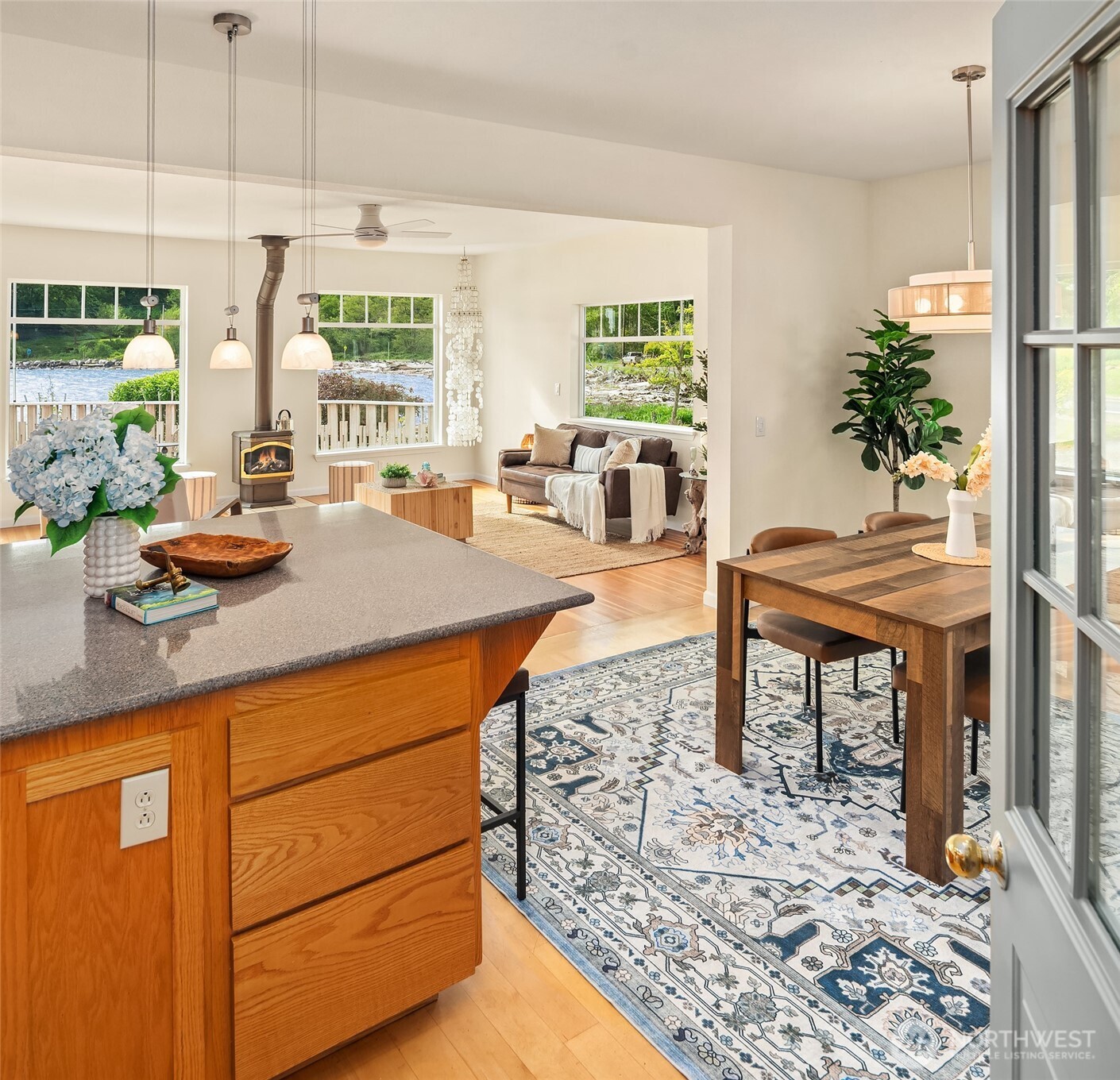 22113 Dockton Road Southwest Vashon, WA 98070 - Photo 18 of 40 a kitchen with a table chairs and a stove