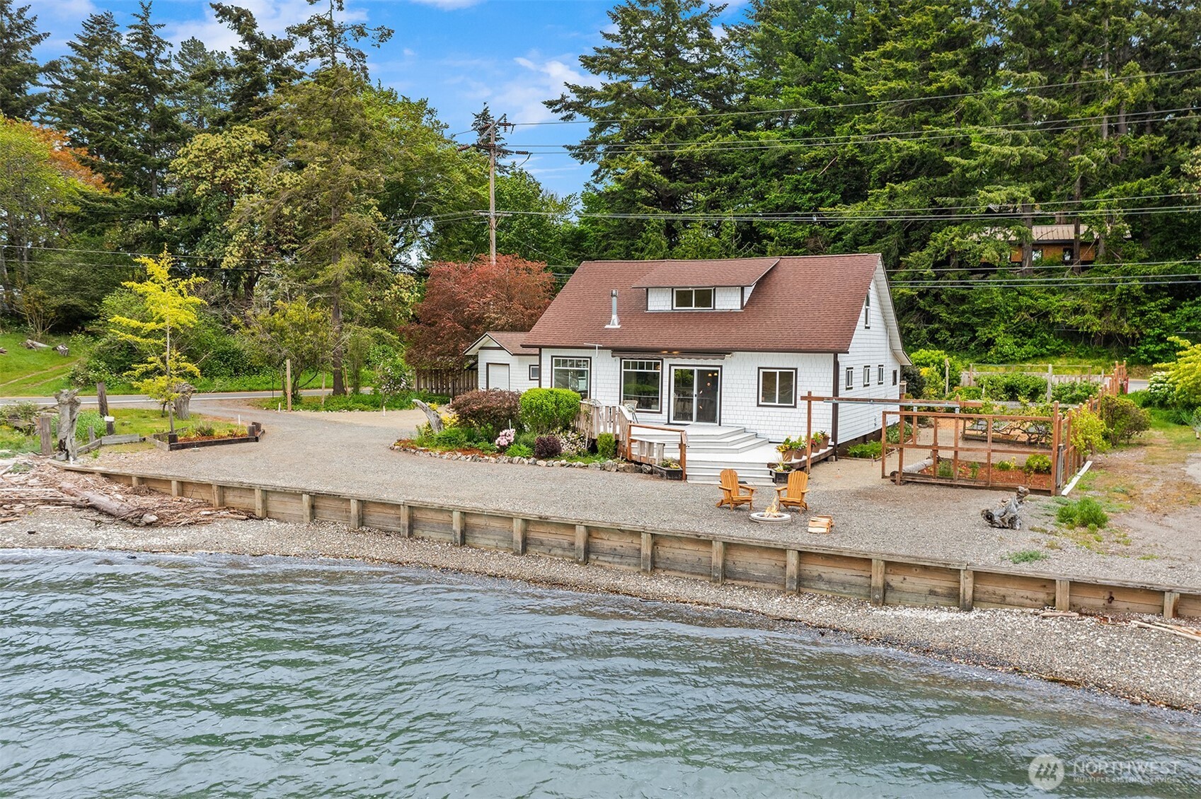 22113 Dockton Road Southwest Vashon, WA 98070 - Photo 2 of 40 a view of house with a yard and large trees