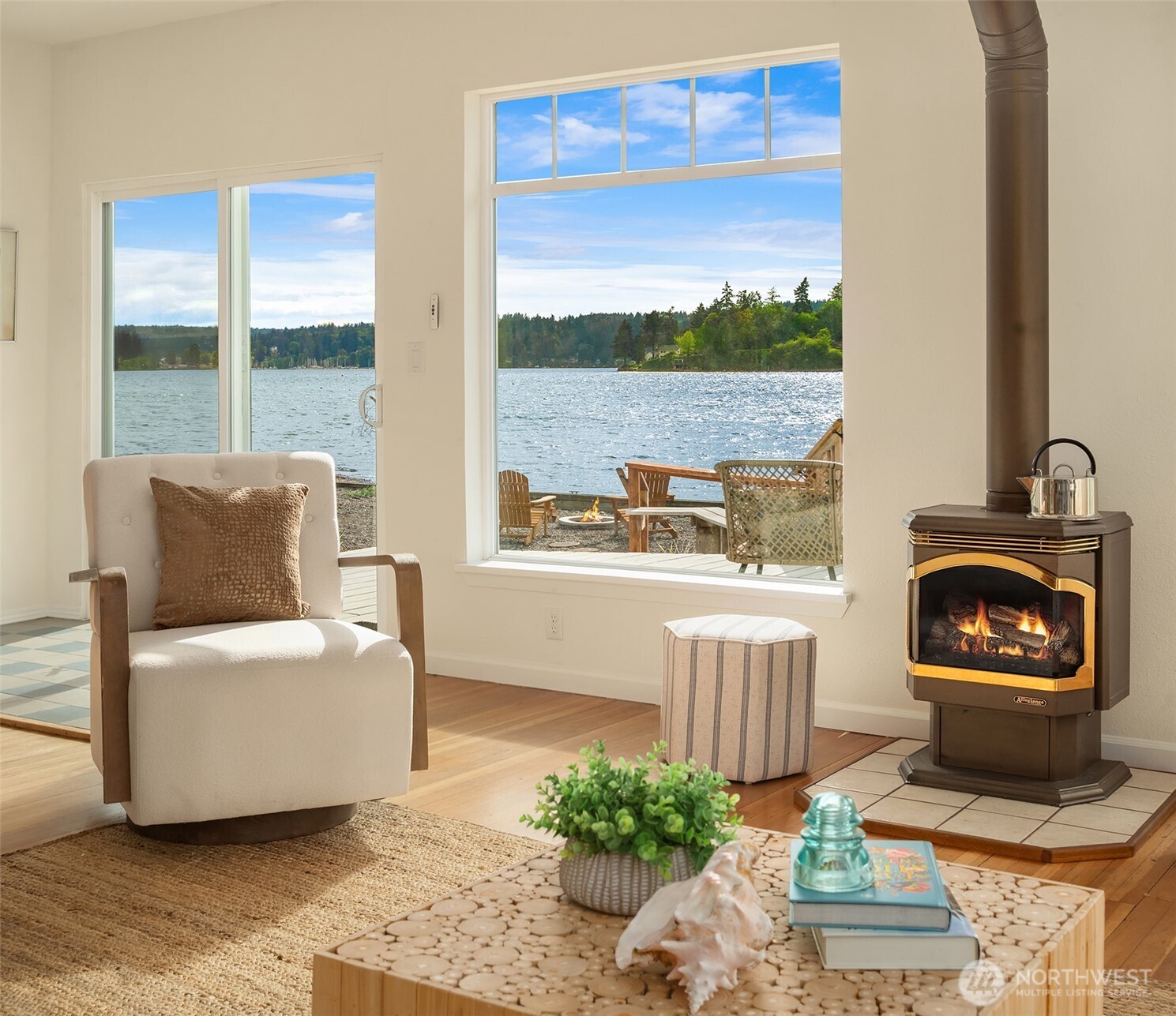 22113 Dockton Road Southwest Vashon, WA 98070 - Photo 23 of 40 a living room with furniture and a floor to ceiling window