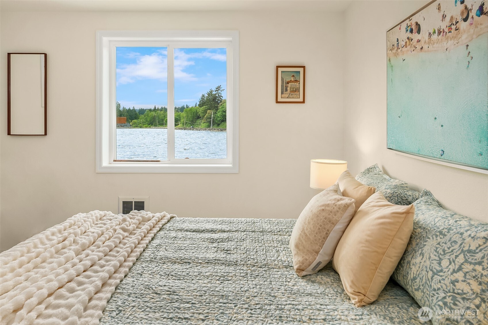 22113 Dockton Road Southwest Vashon, WA 98070 - Photo 24 of 40 a bedroom with a bed and a window