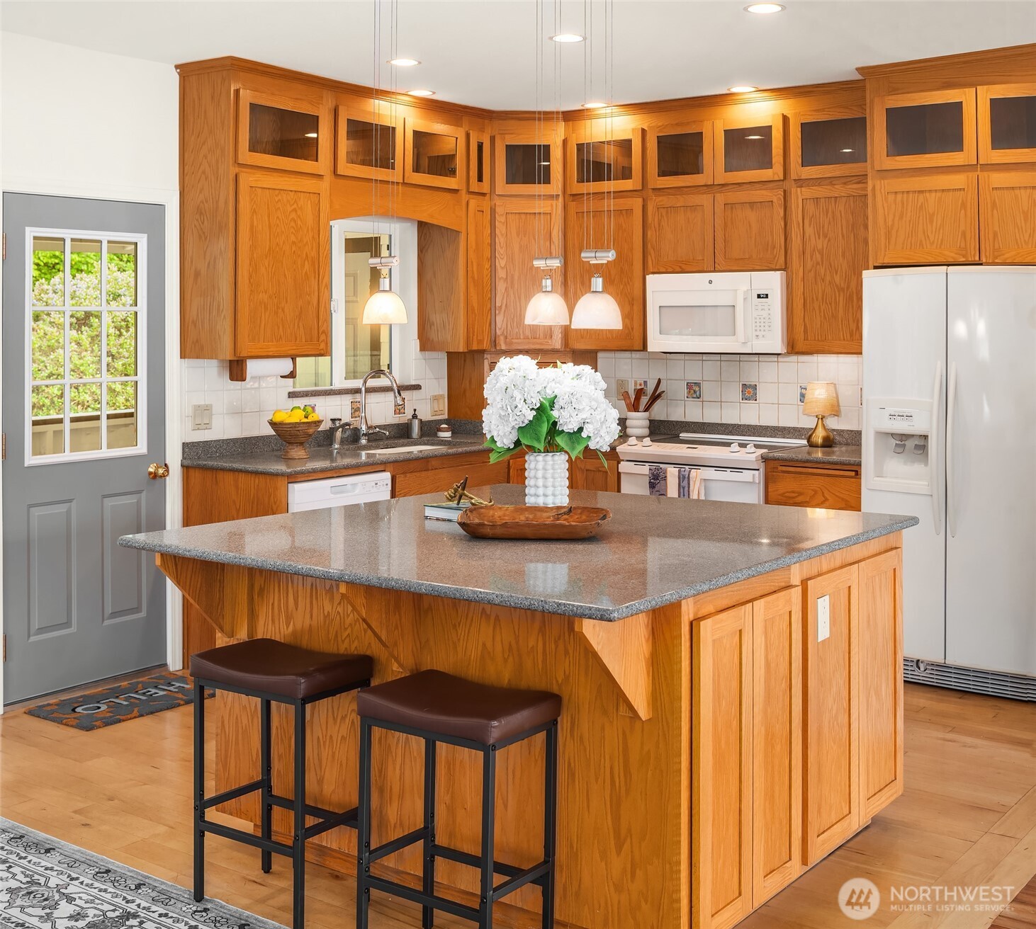22113 Dockton Road Southwest Vashon, WA 98070 - Photo 27 of 40 a dining table with chairs and window