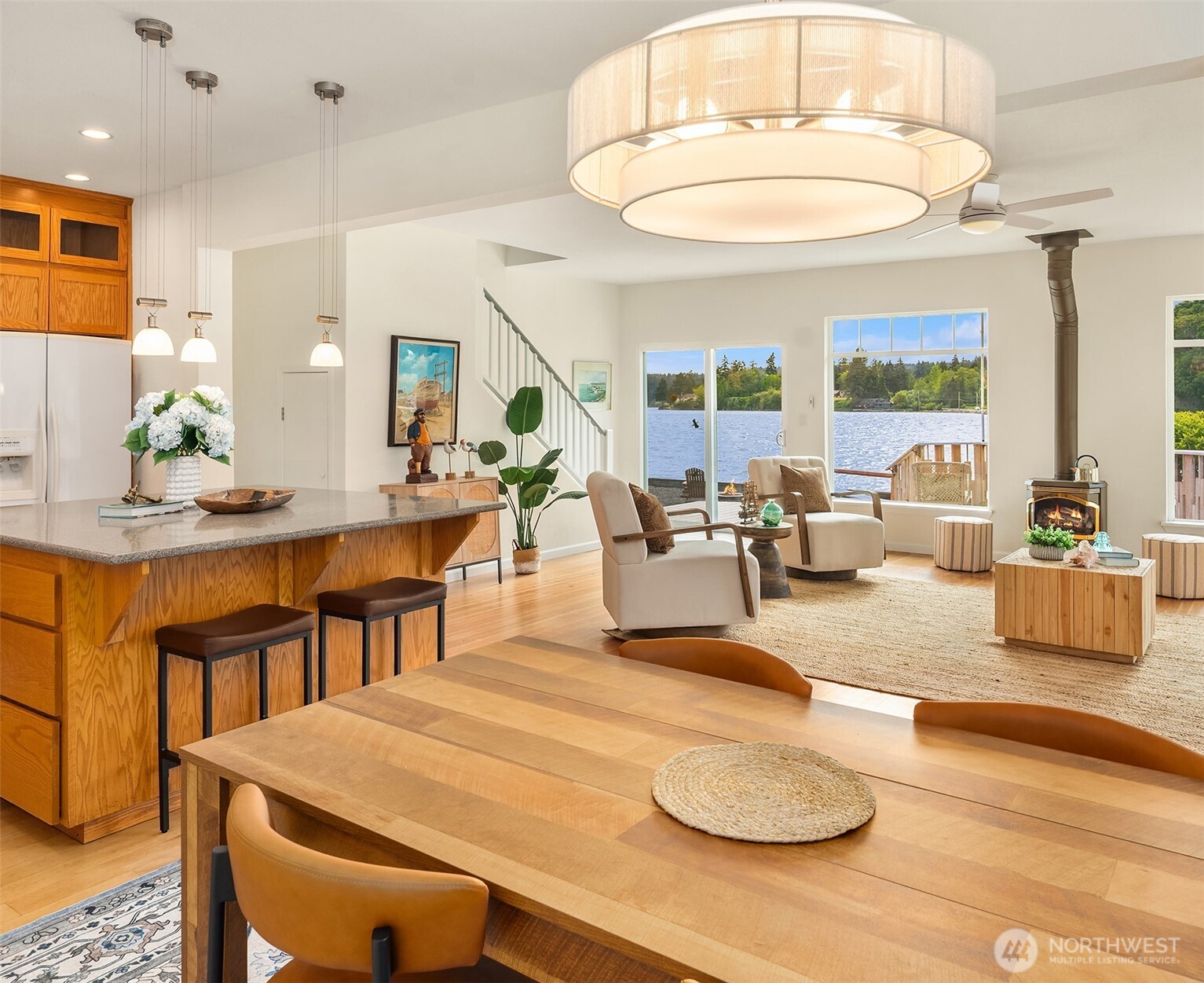 22113 Dockton Road Southwest Vashon, WA 98070 - Photo 29 of 40 a living room with furniture a table and a chandelier