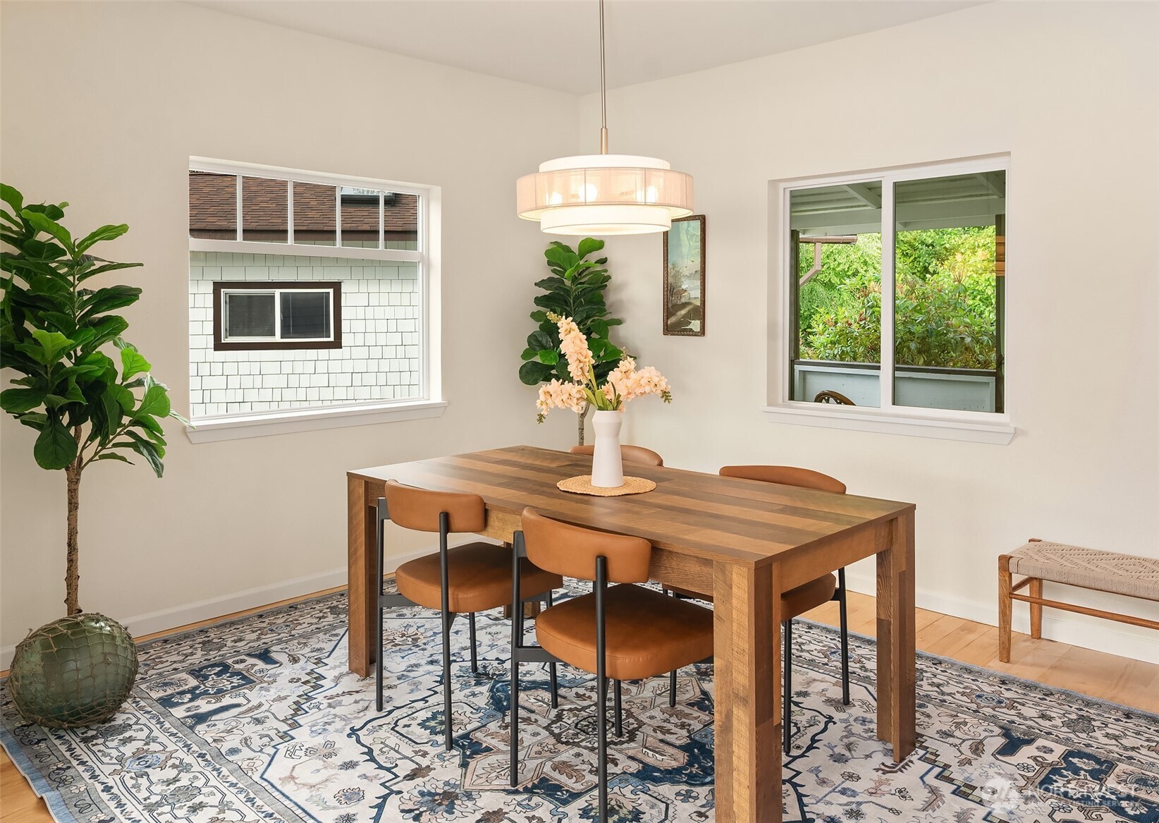 22113 Dockton Road Southwest Vashon, WA 98070 - Photo 31 of 40 a house dining room with furniture window and wooden floor