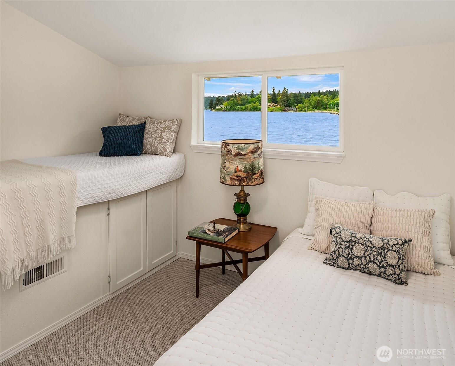 22113 Dockton Road Southwest Vashon, WA 98070 - Photo 36 of 40 a bedroom with a bed and a table in it
