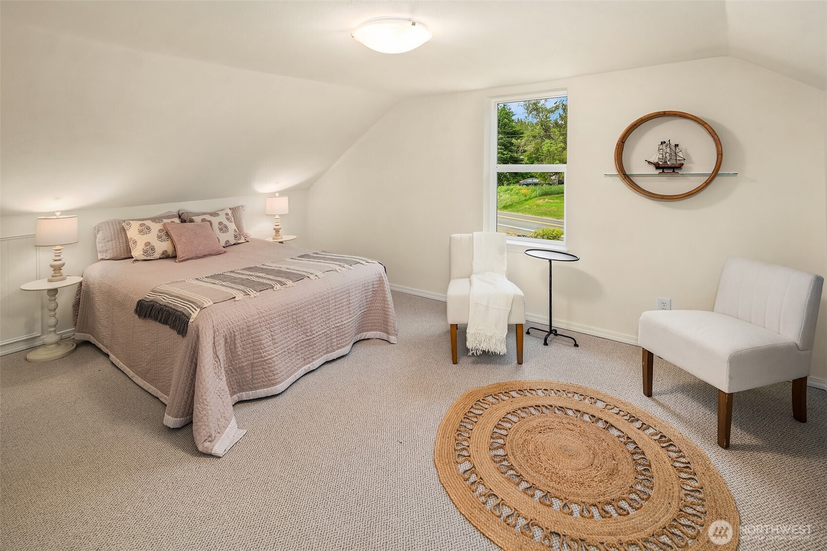22113 Dockton Road Southwest Vashon, WA 98070 - Photo 37 of 40 a bed room with a bed and a chair