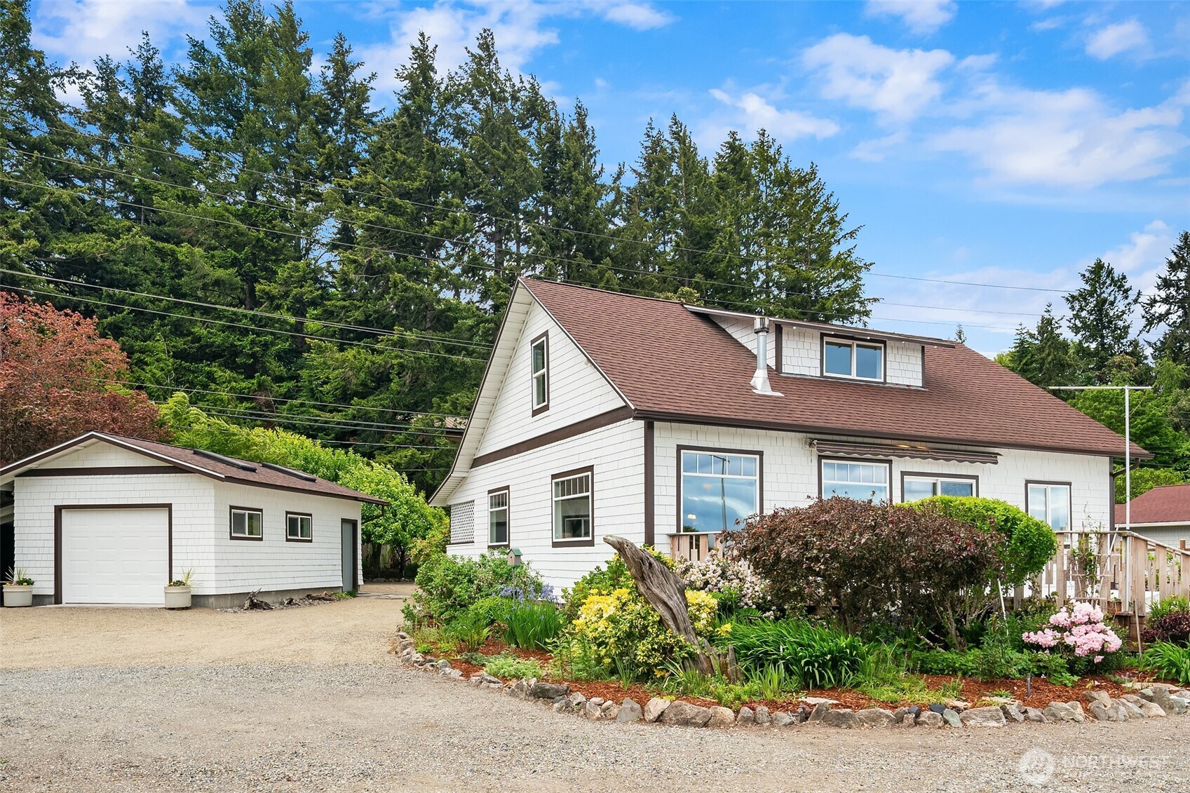 22113 Dockton Road Southwest Vashon, WA 98070 - Photo 40 of 40 a house that has a tree in front of it