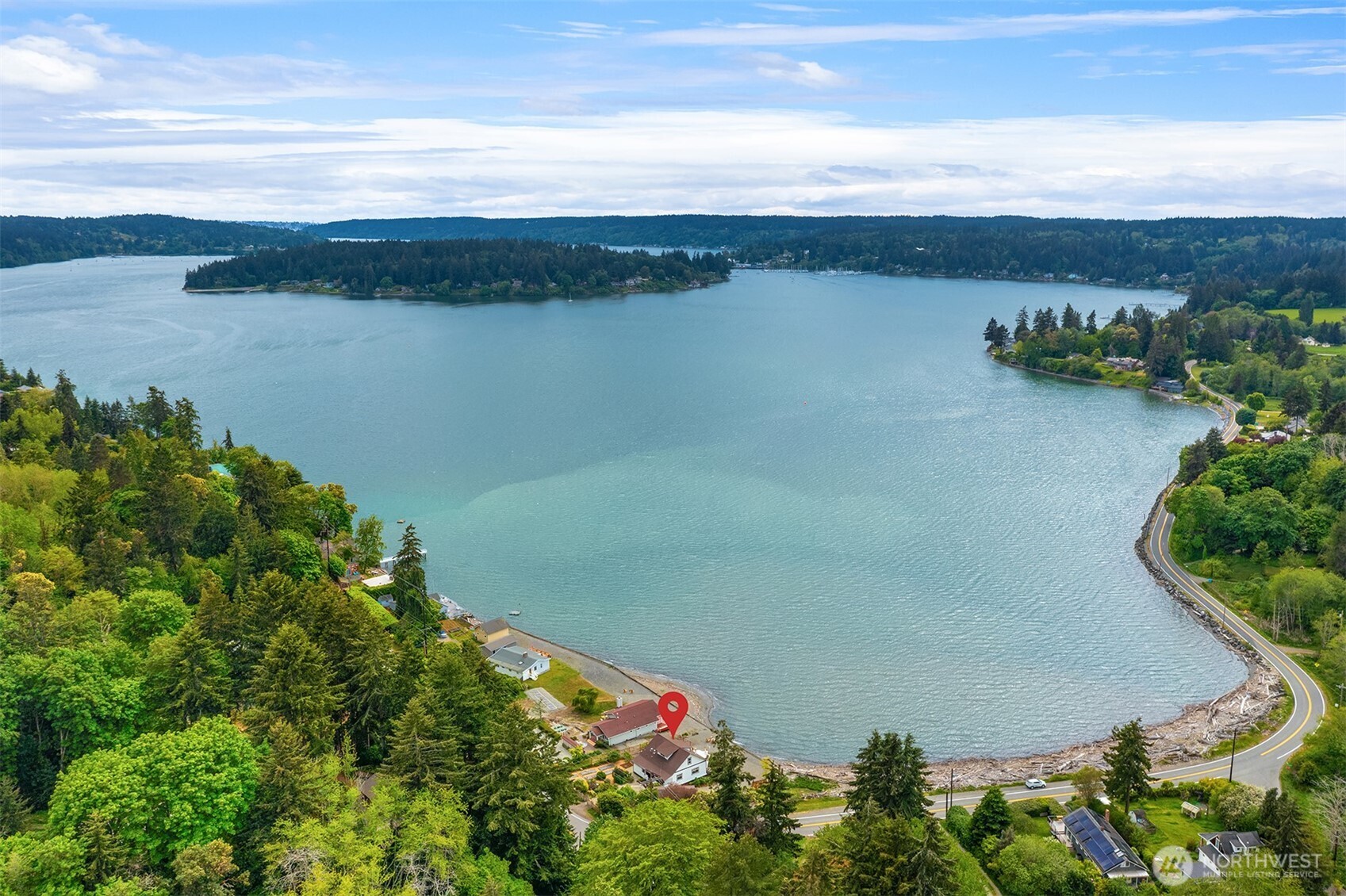 22113 Dockton Road Southwest Vashon, WA 98070 - Photo 5 of 40 a view of a lake with a mountain in the background