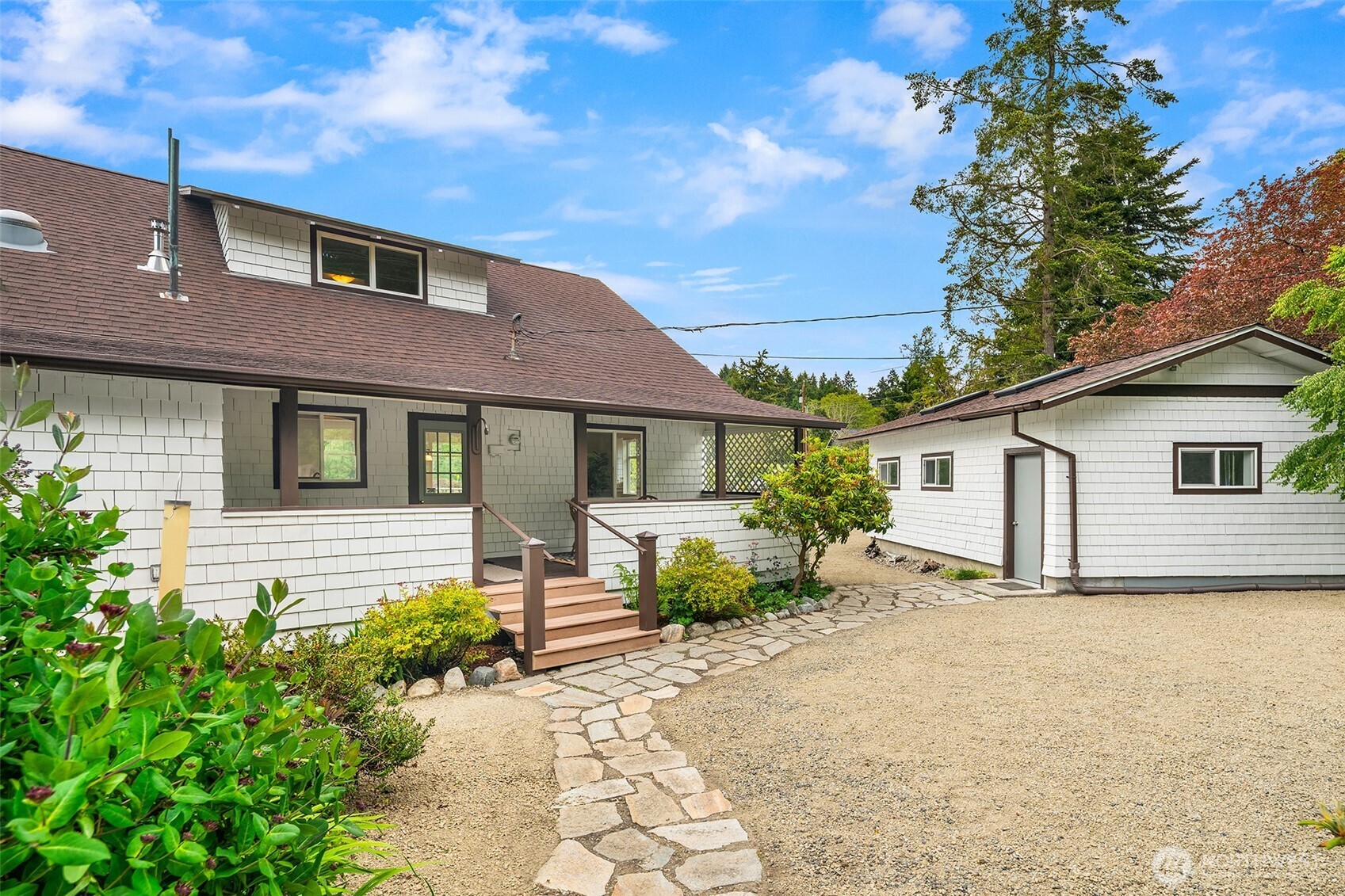 22113 Dockton Road Southwest Vashon, WA 98070 - Photo 10 of 40 a front view of a house with garden
