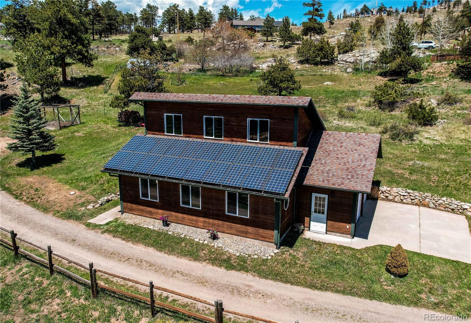 63 Plains View Road Boulder, CO 80302 - Photo 13 of 48 a aerial view of a house next to a yard with large tree