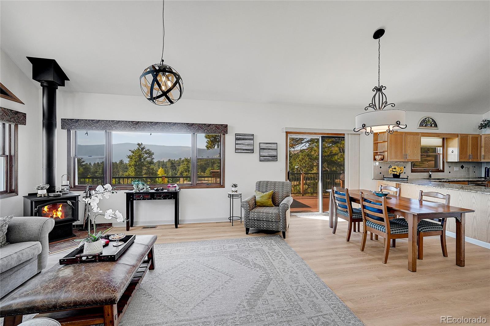 63 Plains View Road Boulder, CO 80302 - Photo 14 of 48 a living room with furniture kitchen view and large windows
