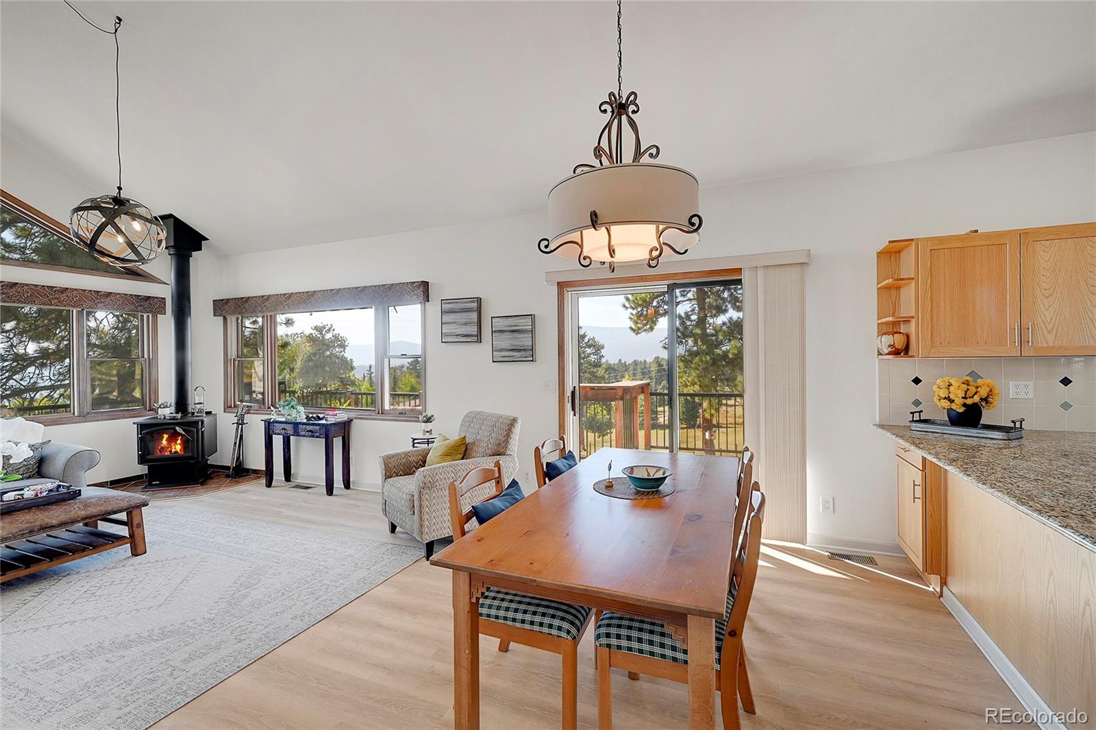 63 Plains View Road Boulder, CO 80302 - Photo 17 of 48 a view of a dining room with furniture window and outside view