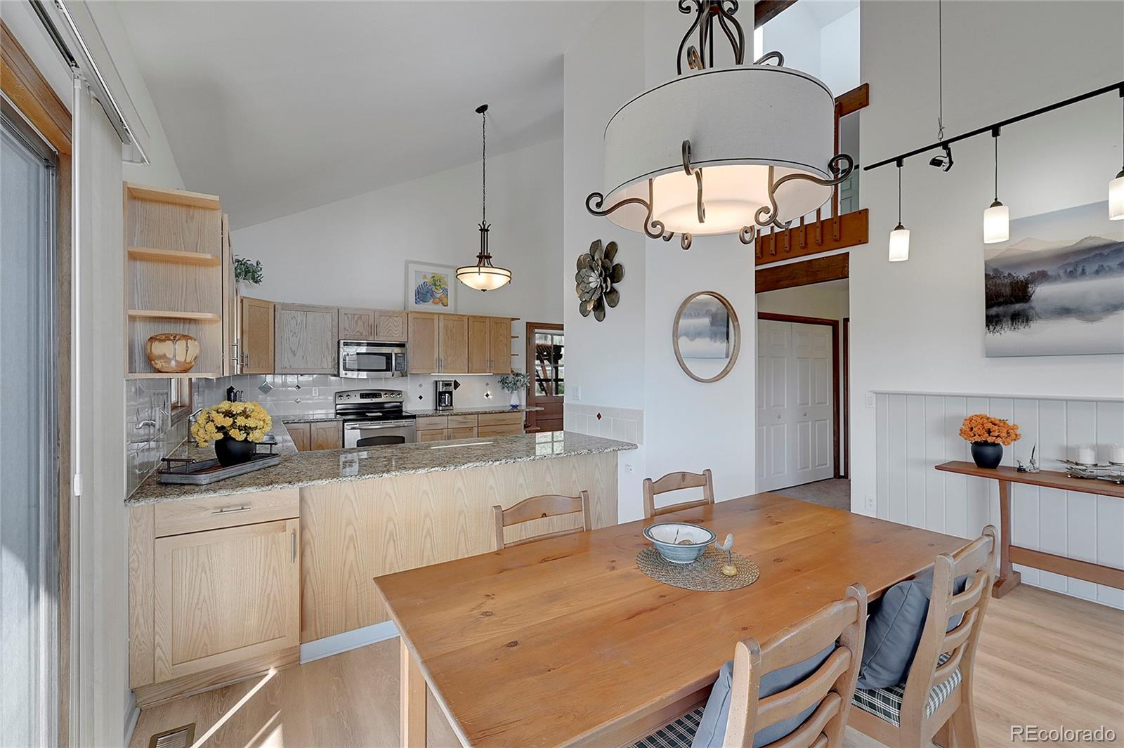 63 Plains View Road Boulder, CO 80302 - Photo 18 of 48 a view of a dining room that has a table and chairs in it