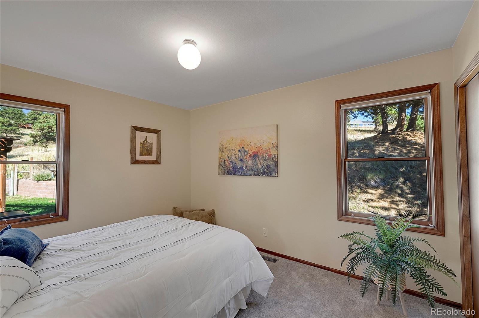 63 Plains View Road Boulder, CO 80302 - Photo 21 of 48 a bedroom with a bed and a window