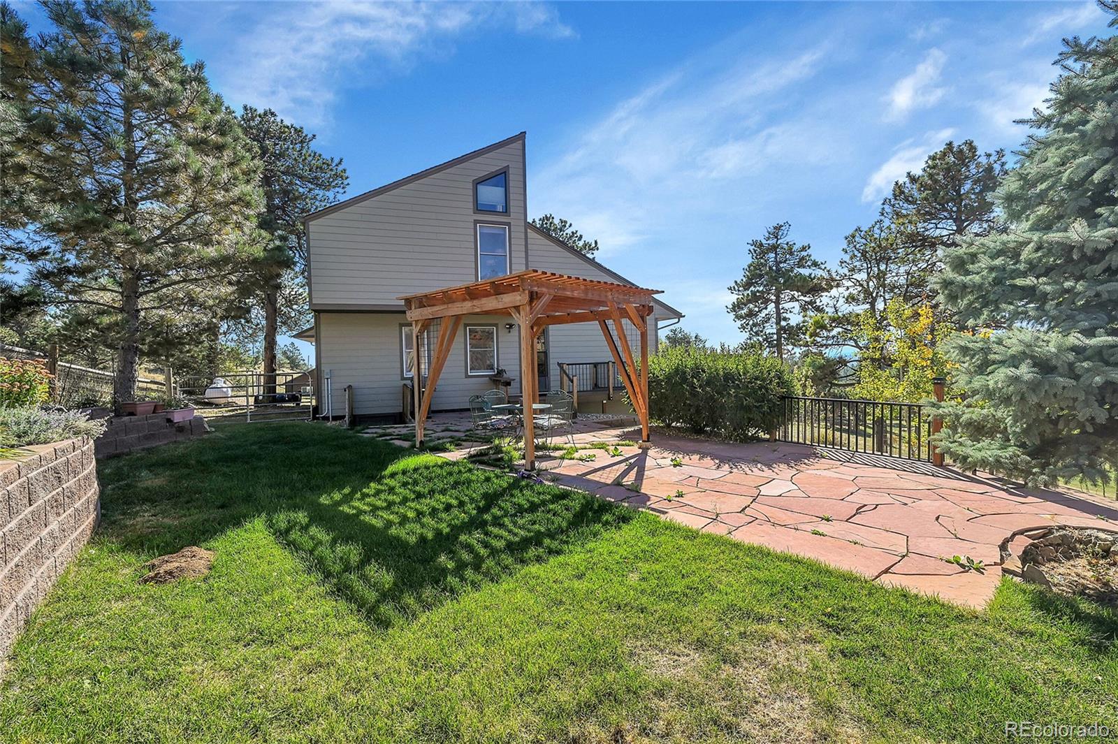 63 Plains View Road Boulder, CO 80302 - Photo 7 of 48 a view of a house with backyard and sitting area
