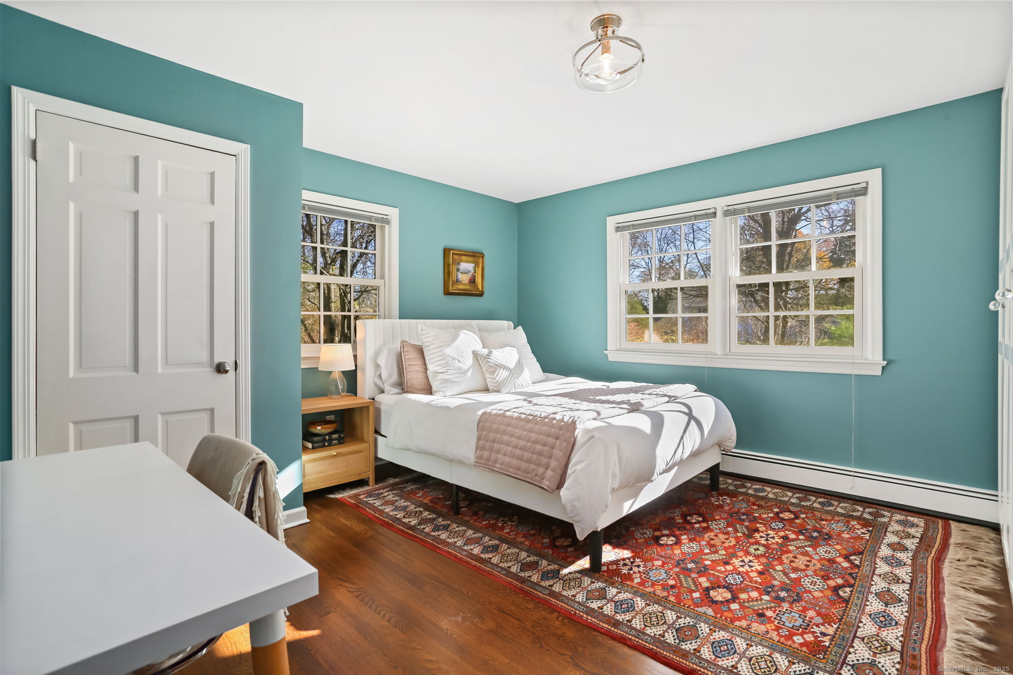 5 Willow Walk Road Westport, CT 06880 - Photo 25 of 40 a bedroom with a bed and wooden floor