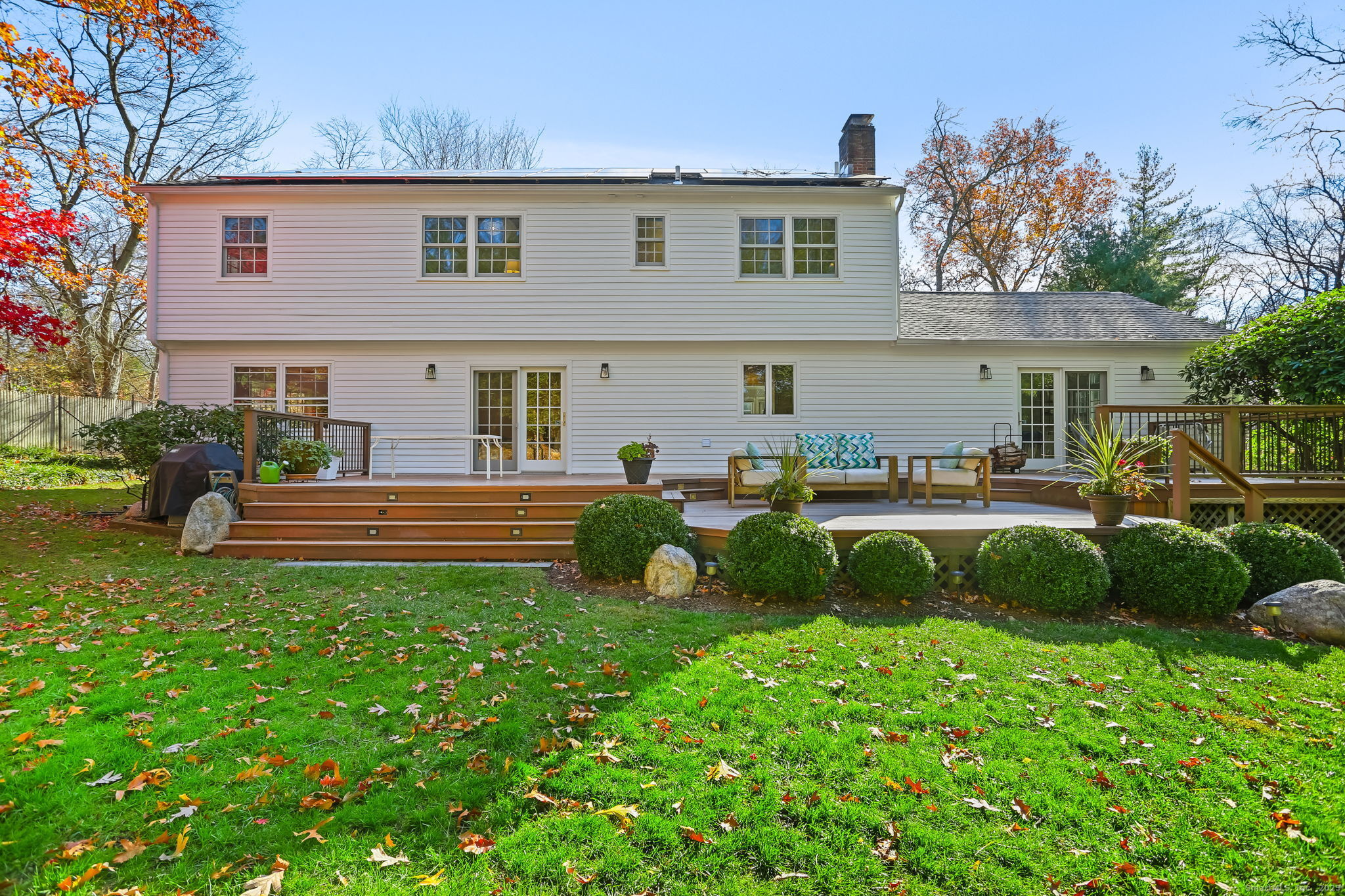 5 Willow Walk Road Westport, CT 06880 - Photo 32 of 40 a view of a house with backyard sitting area and garden