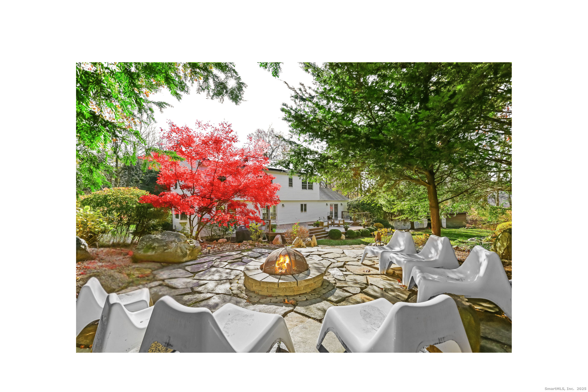 5 Willow Walk Road Westport, CT 06880 - Photo 36 of 40 a view of a patio with table and chairs and potted plants